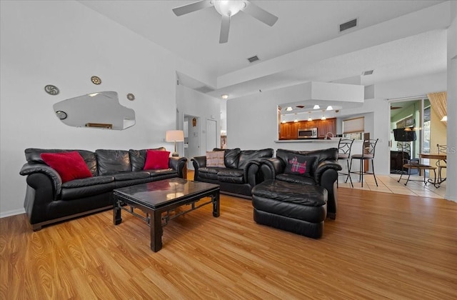 14178 Pullman Dr, Spring Hill, FL 34609 - living room with light wood finished floors and ceiling fan