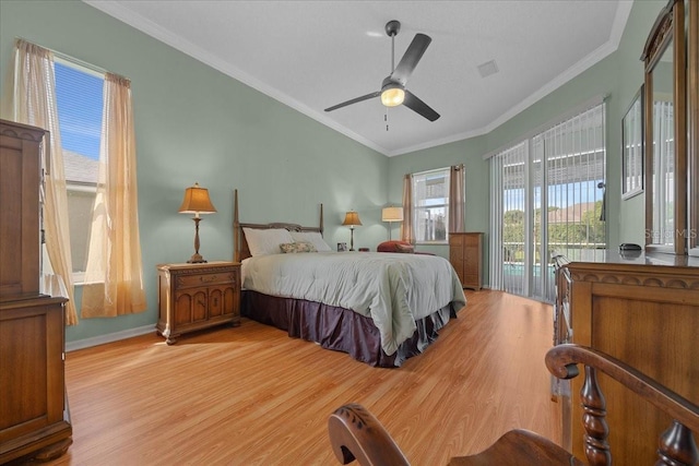 14178 Pullman Dr, Spring Hill, FL 34609 - bedroom featuring access to exterior, light wood finished floors, crown molding, and a ceiling fan