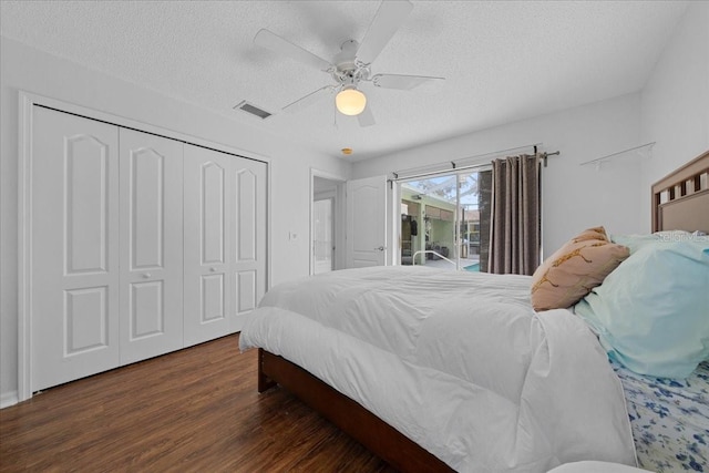 14178 Pullman Dr, Spring Hill, FL 34609 - bedroom featuring access to exterior, a textured ceiling, wood finished floors, a closet, and a ceiling fan