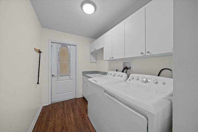 14178 Pullman Dr, Spring Hill, FL 34609 - washroom featuring cabinet space, washer and dryer, dark wood finished floors, and a textured ceiling