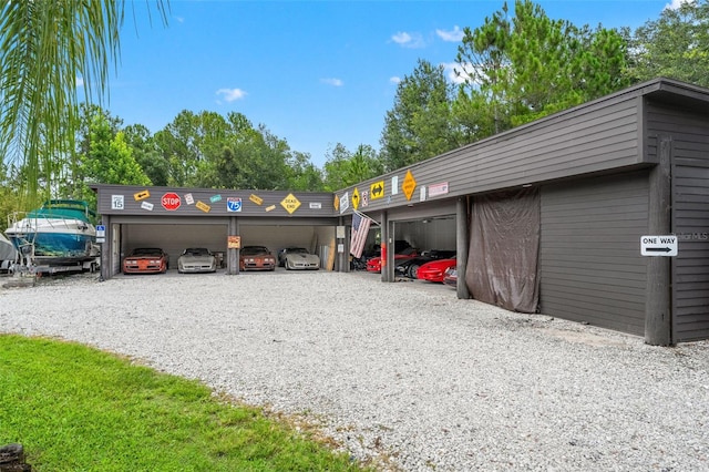 26221 Pheasant Run, Wesley Chapel, FL 33544 - view of parking / parking lot featuring a detached garage