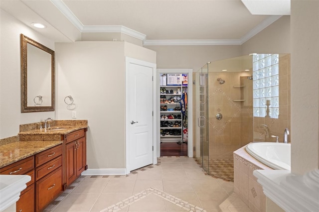 26221 Pheasant Run, Wesley Chapel, FL 33544 - bathroom featuring tile patterned floors, a stall shower, a bath, vanity, and ornamental molding