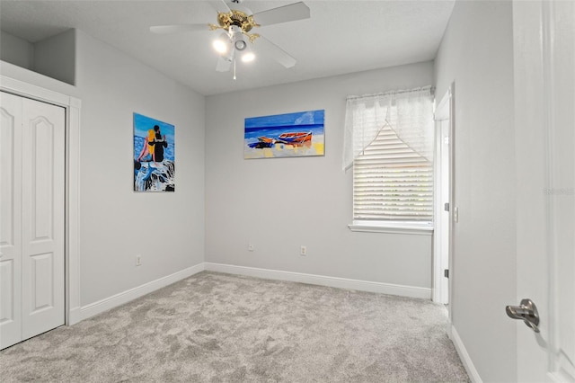 26221 Pheasant Run, Wesley Chapel, FL 33544 - unfurnished bedroom with carpet, a ceiling fan, and a closet
