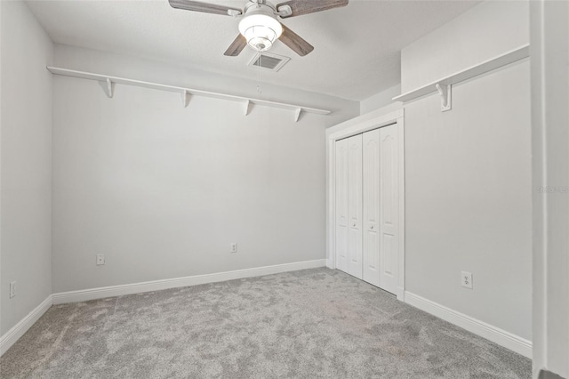 26221 Pheasant Run, Wesley Chapel, FL 33544 - unfurnished bedroom featuring carpet floors, a closet, and ceiling fan