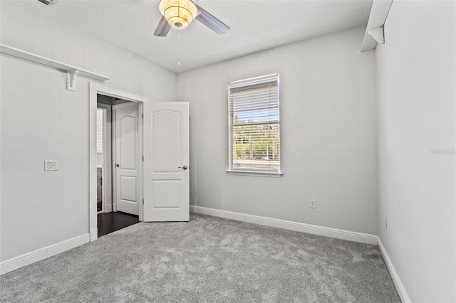 26221 Pheasant Run, Wesley Chapel, FL 33544 - unfurnished bedroom featuring carpet floors and ceiling fan