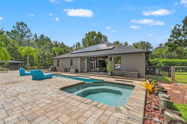 26221 Pheasant Run, Wesley Chapel, FL 33544 - view of pool with a patio, a pool with connected hot tub, and view of wooded area