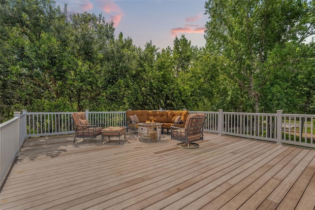 26221 Pheasant Run, Wesley Chapel, FL 33544 - deck at dusk featuring an outdoor living space with a fire pit