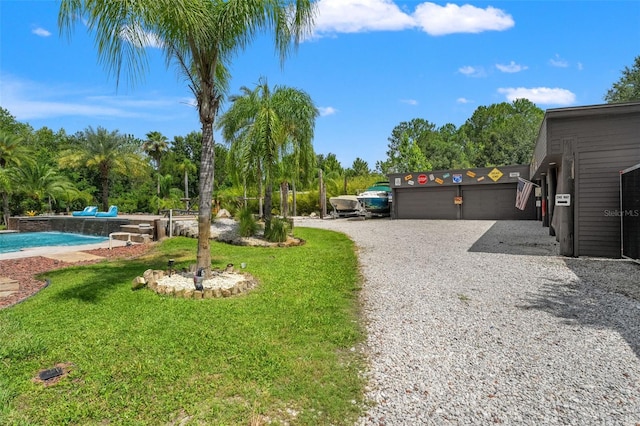 26221 Pheasant Run, Wesley Chapel, FL 33544 - view of yard featuring an outdoor pool and view of wooded area