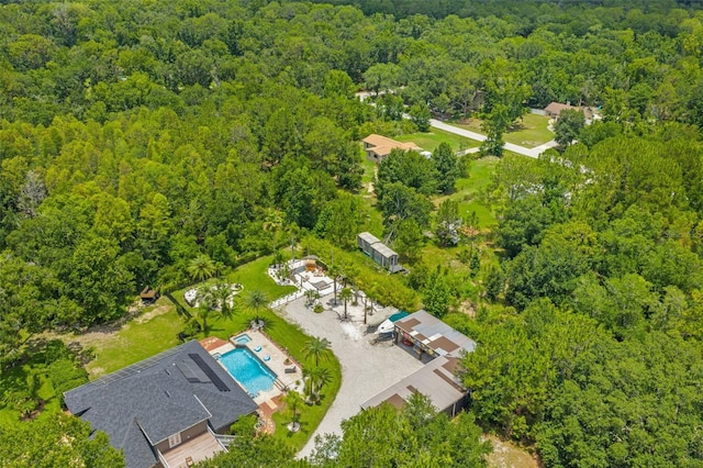 26221 Pheasant Run, Wesley Chapel, FL 33544 - drone / aerial view of a heavily wooded area and a pool area