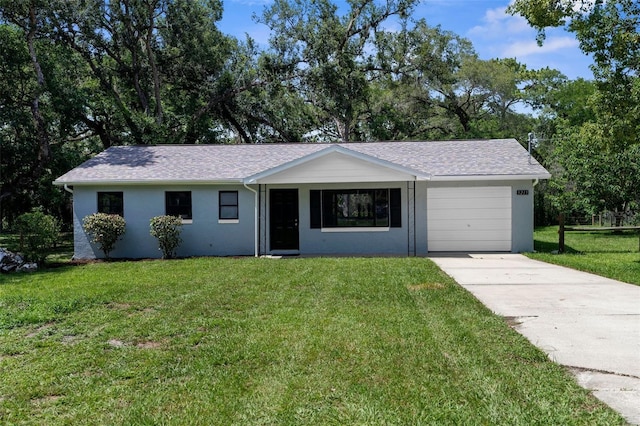 5215 Azalea Cir, Dade City, FL 33523 - ranch-style house featuring a garage, concrete driveway, a front yard, and stucco siding