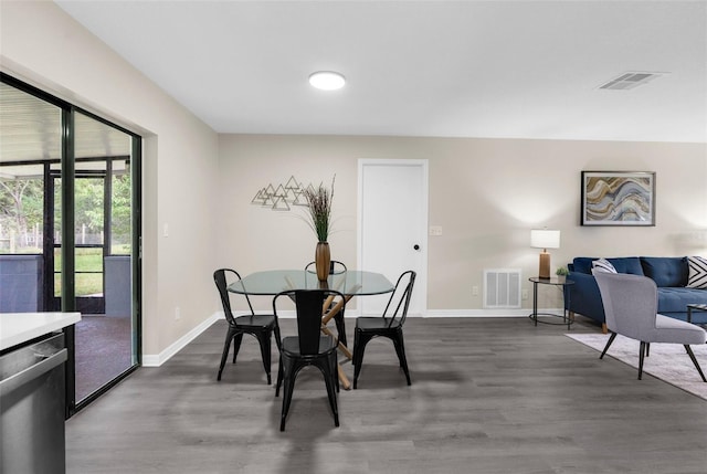 5215 Azalea Cir, Dade City, FL 33523 - dining room with dark wood finished floors and baseboards