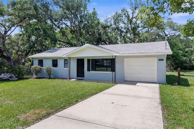 5215 Azalea Cir, Dade City, FL 33523 - single story home with driveway, a garage, a front lawn, and stucco siding