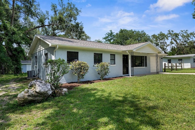 5215 Azalea Cir, Dade City, FL 33523 - view of front of house featuring a front yard and stucco siding