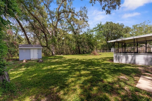 5215 Azalea Cir, Dade City, FL 33523 - view of grassy yard with a storage unit