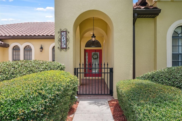 9829 Sorbonne Loop, Seffner, FL 33584 - property entrance featuring stucco siding, a tile roof, and a wall mounted AC