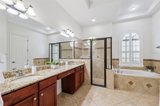 9829 Sorbonne Loop, Seffner, FL 33584 - full bathroom with a raised ceiling, tile patterned flooring, a bath, a shower stall, and recessed lighting