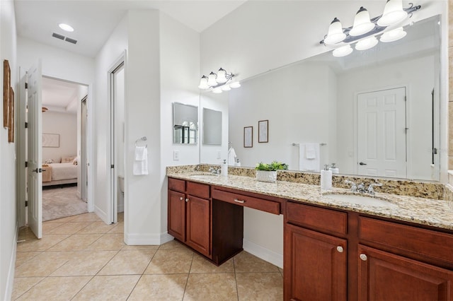 9829 Sorbonne Loop, Seffner, FL 33584 - full bath featuring ensuite bathroom, double vanity, tile patterned floors, and a chandelier