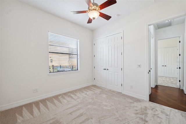 9829 Sorbonne Loop, Seffner, FL 33584 - unfurnished bedroom with carpet flooring, a closet, and ceiling fan