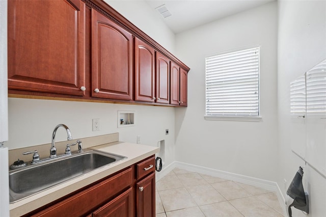 9829 Sorbonne Loop, Seffner, FL 33584 - washroom featuring cabinet space, hookup for an electric dryer, washer hookup, and light tile patterned flooring
