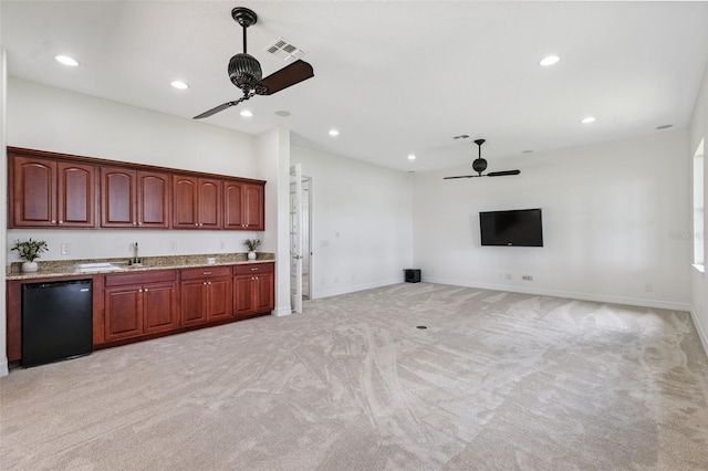 9829 Sorbonne Loop, Seffner, FL 33584 - kitchen with ceiling fan, dishwasher, light carpet, recessed lighting, and light stone counters