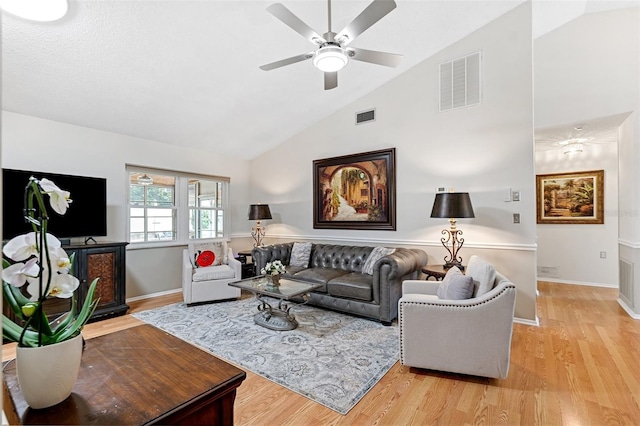 3204 Payne St, New Port Richey, FL 34655 - living area featuring ceiling fan, light wood-type flooring, and high vaulted ceiling