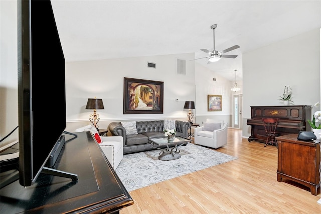 3204 Payne St, New Port Richey, FL 34655 - living area with a ceiling fan, light wood-style floors, and high vaulted ceiling