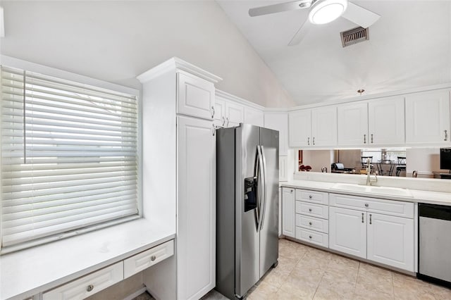 3204 Payne St, New Port Richey, FL 34655 - kitchen featuring stainless steel appliances, lofted ceiling, white cabinets, a ceiling fan, and light countertops