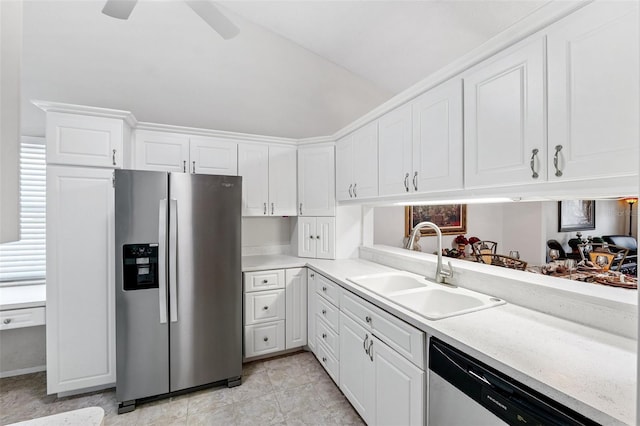 3204 Payne St, New Port Richey, FL 34655 - kitchen featuring appliances with stainless steel finishes, light countertops, white cabinets, lofted ceiling, and a ceiling fan