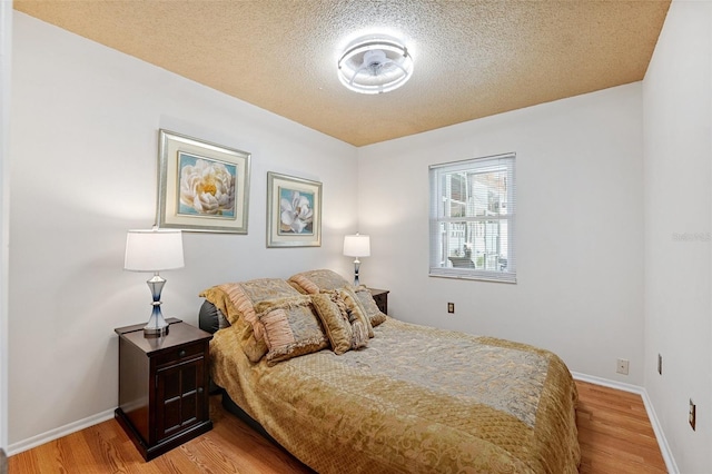 3204 Payne St, New Port Richey, FL 34655 - bedroom with light wood-style floors and a textured ceiling