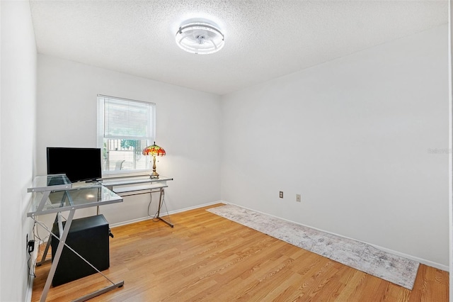 3204 Payne St, New Port Richey, FL 34655 - office area featuring wood finished floors and a textured ceiling