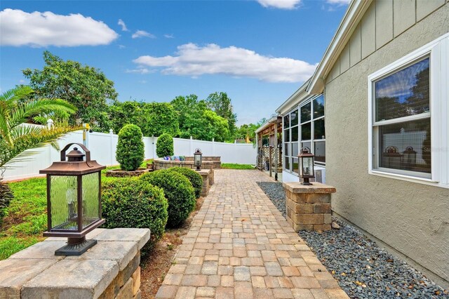 3204 Payne St, New Port Richey, FL 34655 - fenced backyard with a patio area