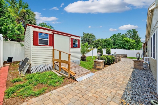 3204 Payne St, New Port Richey, FL 34655 - fenced backyard with an outdoor structure and a patio