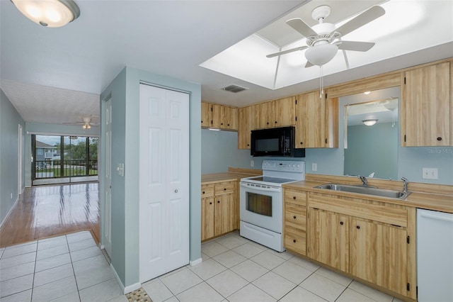 5640 Ferguson Ct Unit 2203, New Port Richey, FL 34652 - kitchen with white appliances, a ceiling fan, light brown cabinetry, light tile patterned floors, and light countertops