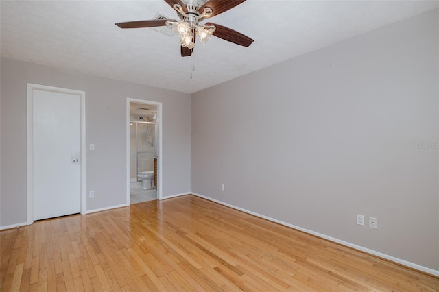 5640 Ferguson Ct Unit 2203, New Port Richey, FL 34652 - unfurnished bedroom featuring light wood-style flooring, ensuite bathroom, and ceiling fan