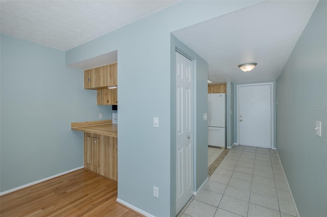 5640 Ferguson Ct Unit 2203, New Port Richey, FL 34652 - hall featuring baseboards and light wood-type flooring