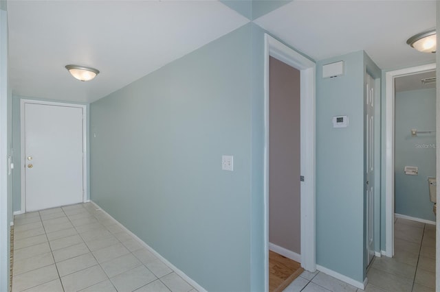 5640 Ferguson Ct Unit 2203, New Port Richey, FL 34652 - hall with light tile patterned floors and baseboards