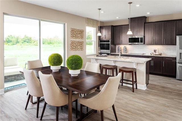 3878 Isle Royal Pl, Apopka, FL 32712 - dining area featuring light wood finished floors and recessed lighting