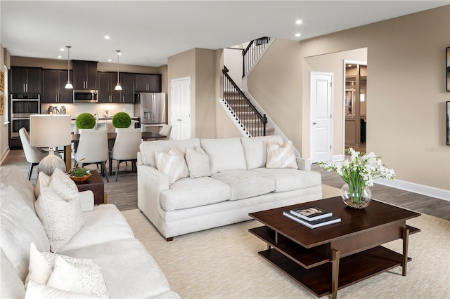 3878 Isle Royal Pl, Apopka, FL 32712 - living room with stairway, recessed lighting, and light wood-style flooring