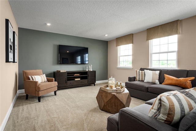 3878 Isle Royal Pl, Apopka, FL 32712 - living room featuring light carpet, a textured ceiling, and recessed lighting