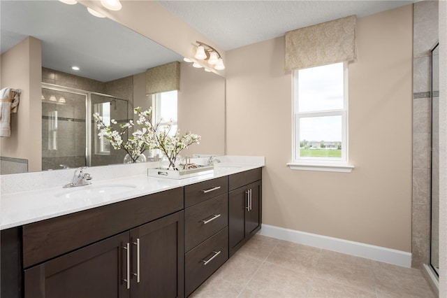 3878 Isle Royal Pl, Apopka, FL 32712 - bathroom with double vanity, a shower stall, and tile patterned floors