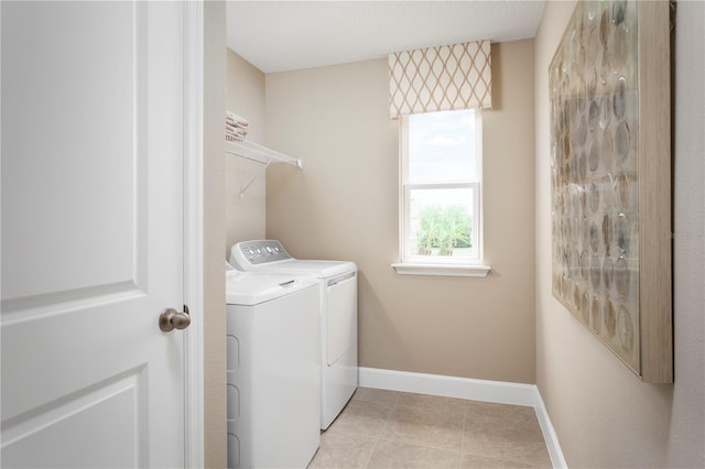 3878 Isle Royal Pl, Apopka, FL 32712 - laundry room with washer and clothes dryer and light tile patterned floors