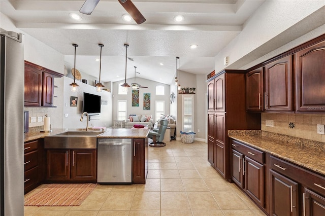1478 Brigadier Dr, Spring Hill, FL 34608 - kitchen featuring appliances with stainless steel finishes, a ceiling fan, a peninsula, vaulted ceiling, and backsplash