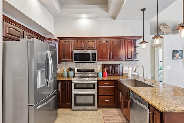 1478 Brigadier Dr, Spring Hill, FL 34608 - kitchen with appliances with stainless steel finishes, a peninsula, tasteful backsplash, and light tile patterned floors