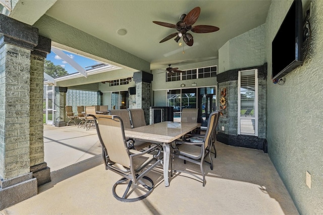 1478 Brigadier Dr, Spring Hill, FL 34608 - view of patio featuring outdoor dining space, a ceiling fan, and glass enclosure