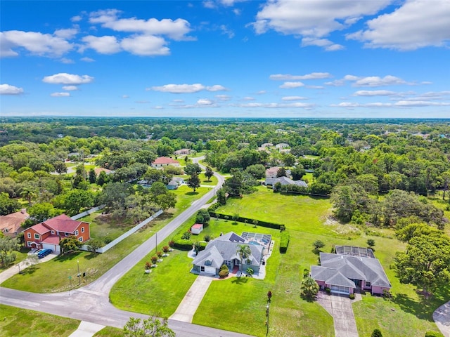 1478 Brigadier Dr, Spring Hill, FL 34608 - aerial perspective of suburban area with a heavily wooded area