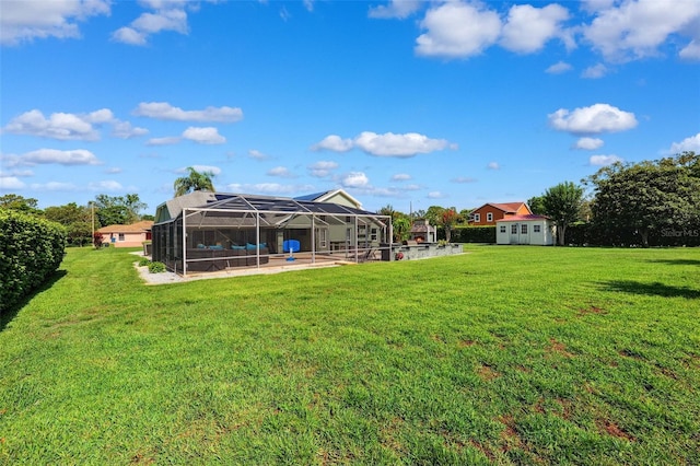1478 Brigadier Dr, Spring Hill, FL 34608 - view of grassy yard with a patio area, glass enclosure, and a storage unit