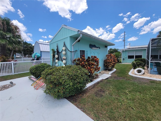 6737 Clark St, Hudson, FL 34667 - view of side of property with a patio