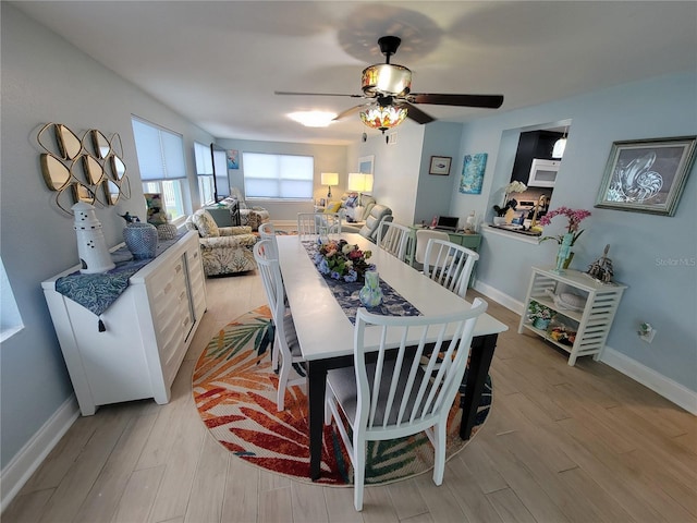6737 Clark St, Hudson, FL 34667 - dining room with light wood-type flooring and ceiling fan