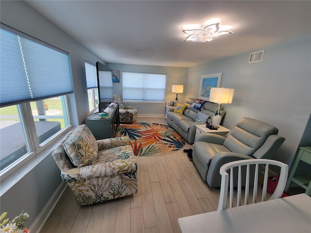 6737 Clark St, Hudson, FL 34667 - living room with wood finished floors and baseboards