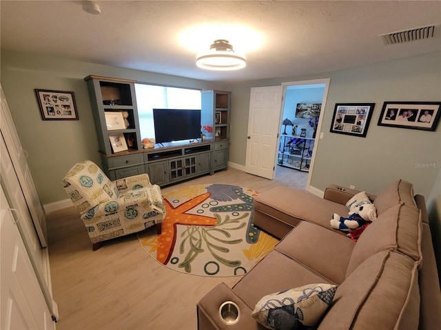 6737 Clark St, Hudson, FL 34667 - living area with baseboards and light wood finished floors
